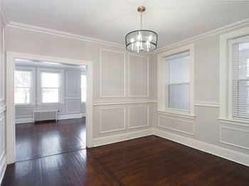 A room with white walls and a wooden floor